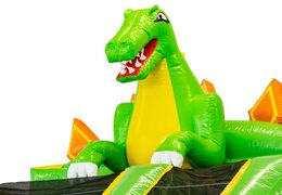 Mega dino no castelo inflável com cor verde