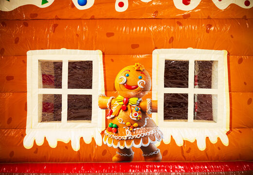 Ilustração de uma figura de gingerbread e janelas no castelo insuflável Multifun JB